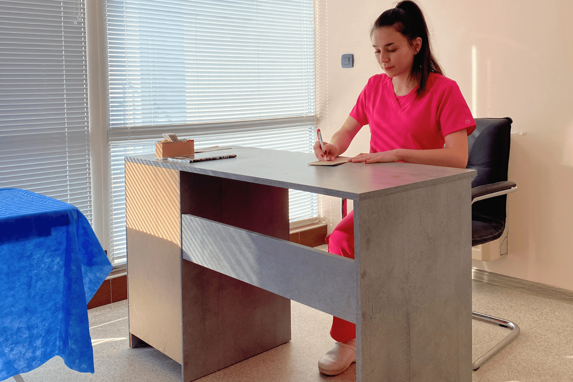 A wonam sitting on a desk